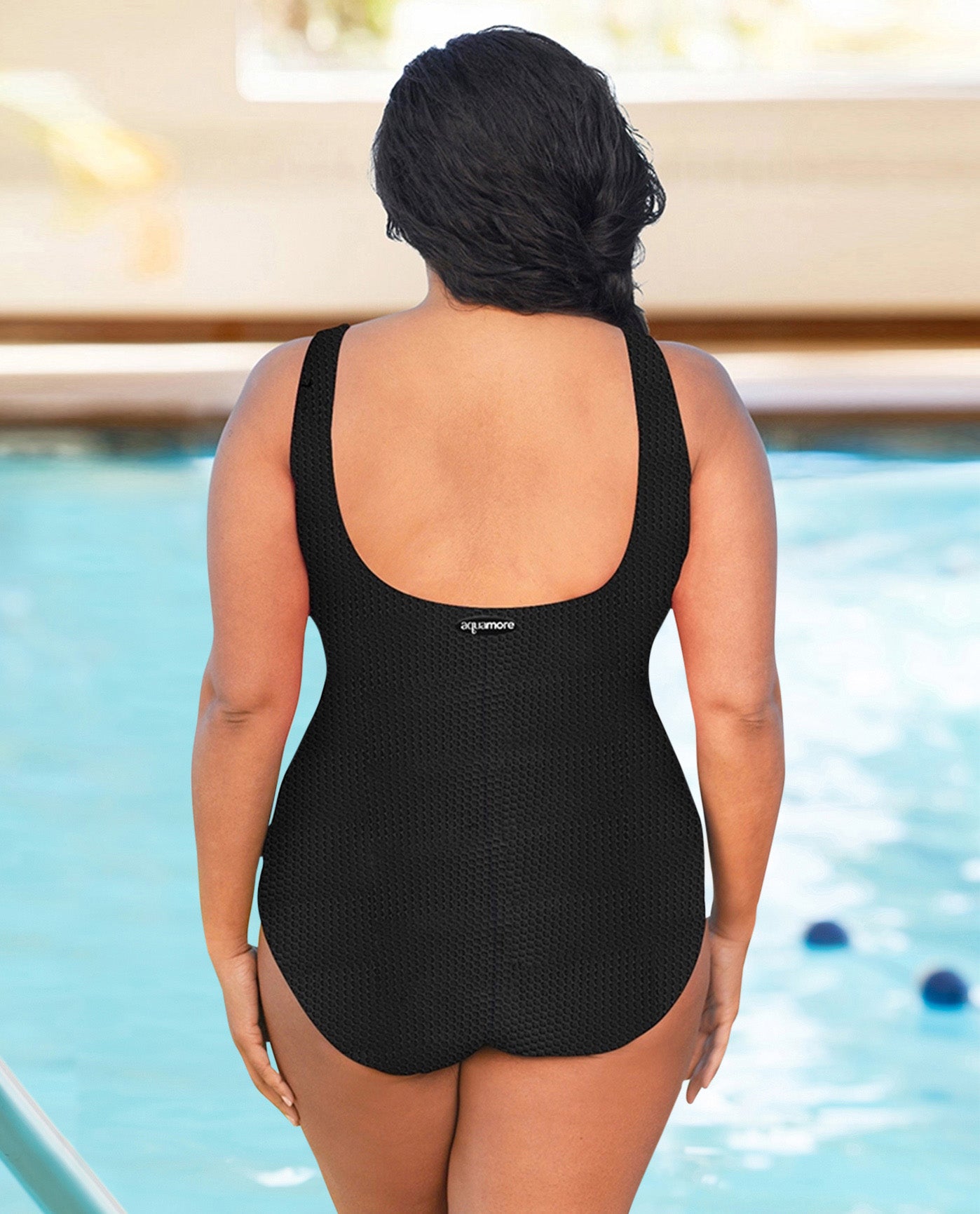 BACK VIEW OF CHLORINE RESISTANT AQUAMORE SOLID TEXTURED HIGH NECK PLUS SIZE SWIMSUIT | 502 AQT TEXTURED BLACK