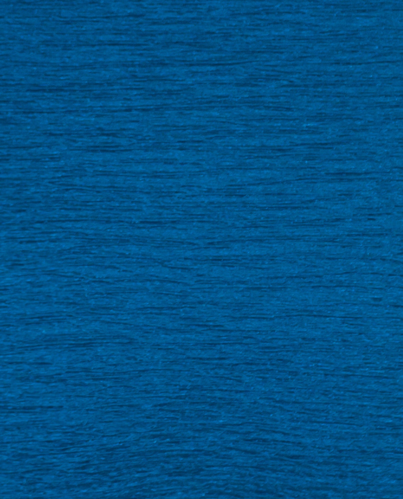 FABRIC DETAIL VIEW OF CHLORINE RESISTANT KRINKLE TEXTURED SOLID CROSS BACK ONE PIECE | KRINKLE MYKONOS BLUE